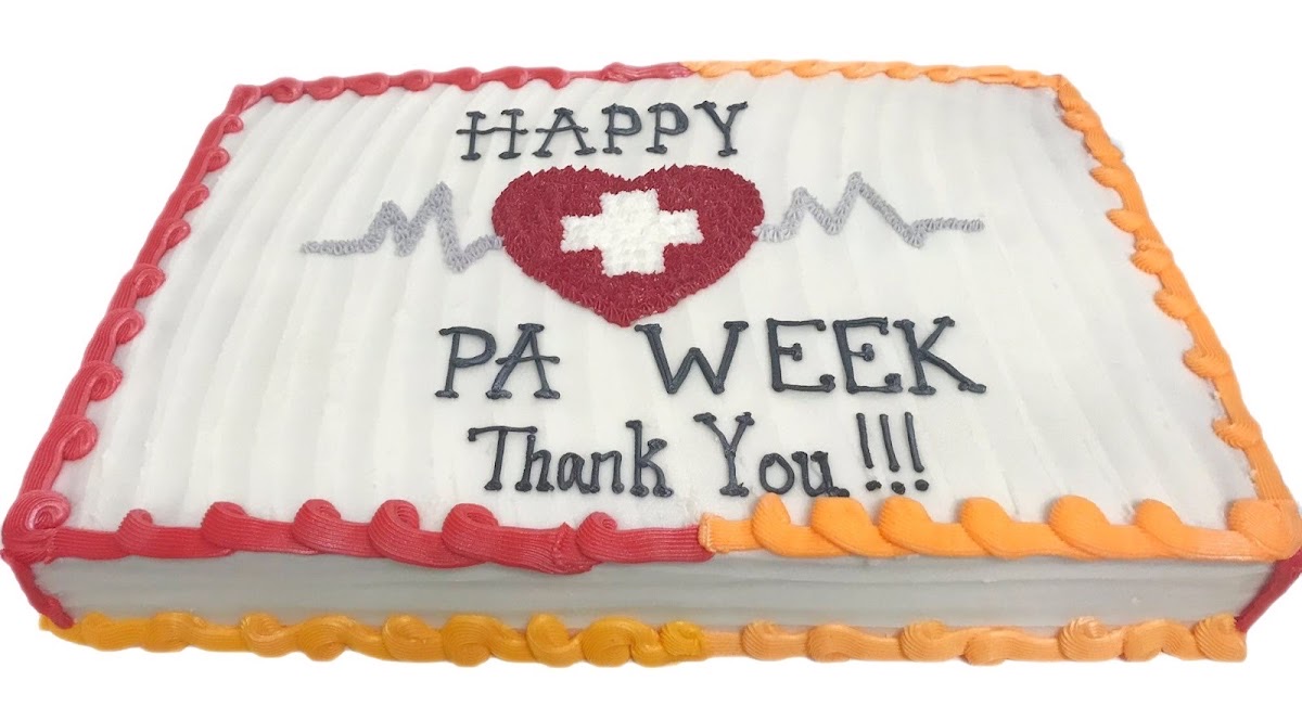 Decorated sheet cake with a heart and EKG line that reads Happy PA Week, Thank You