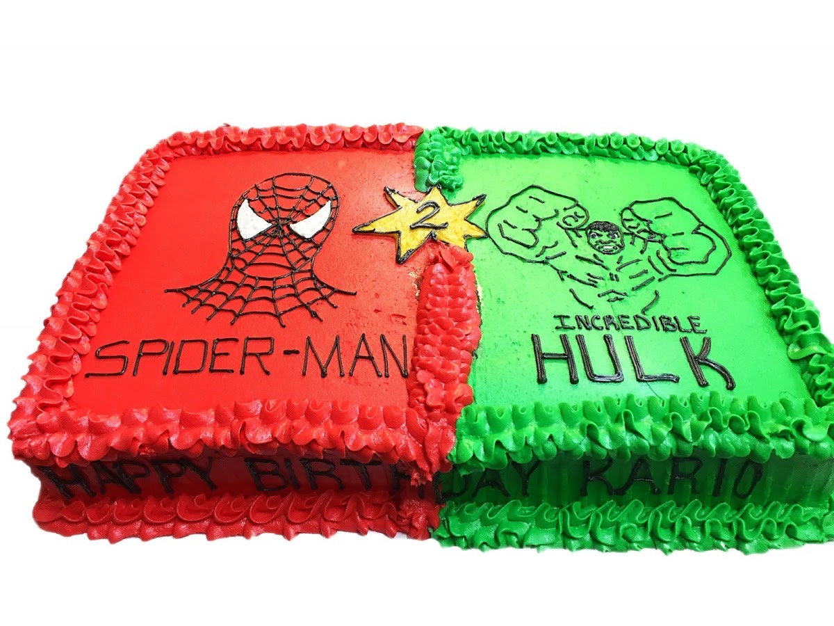 Half Spider-Man, half Hulk themed birthday cake in red and green